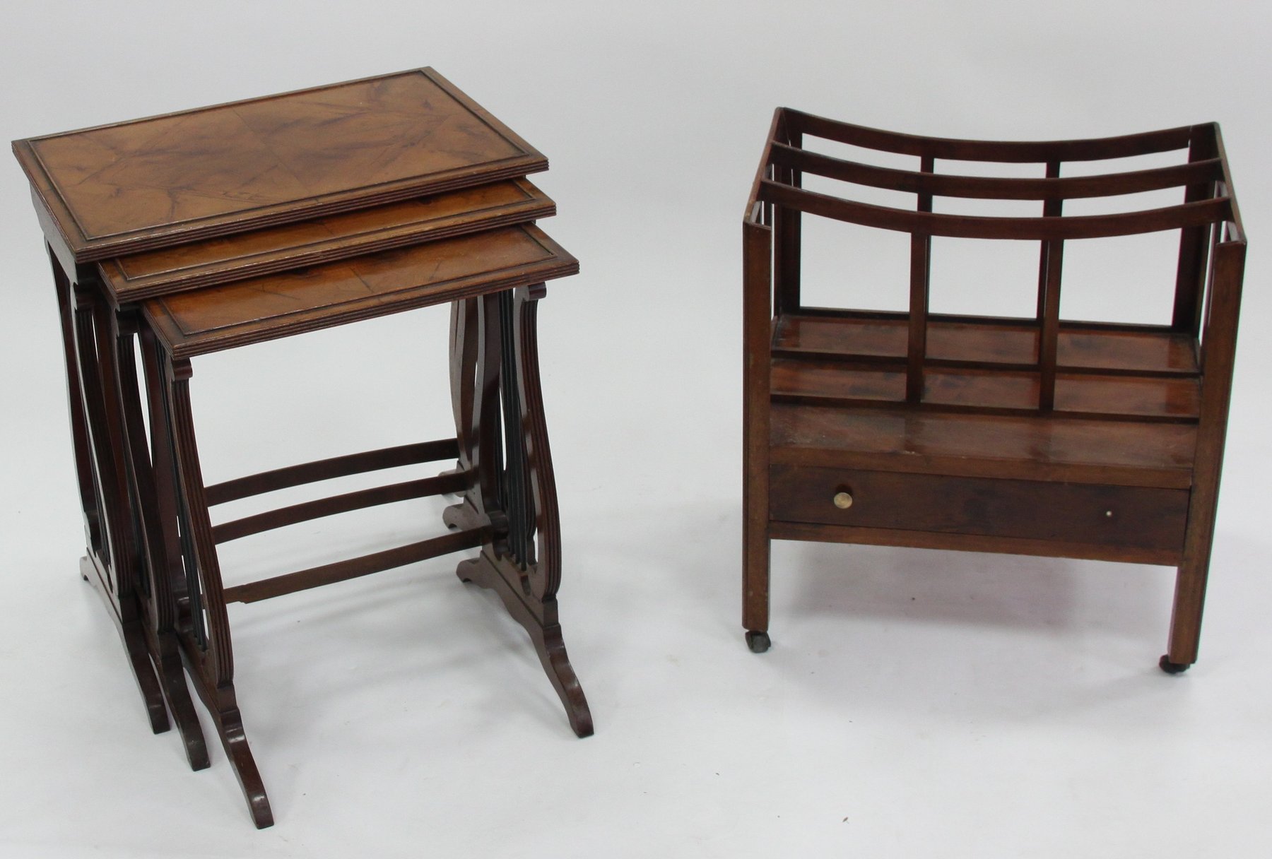 Appraisal: A nest of three tables with lyre shaped supports the