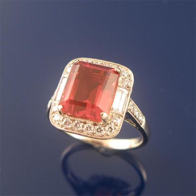 Appraisal: A fire opal and diamond set cluster ring the emerald