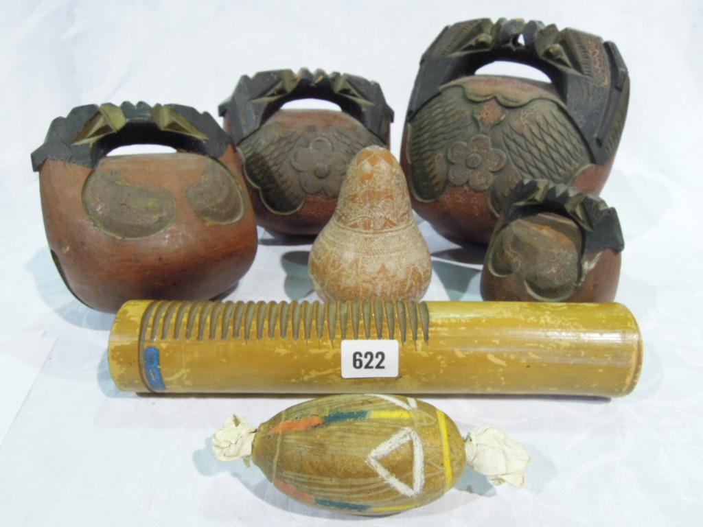 Appraisal: Four graduated percussion bells together with a carved nut kernel