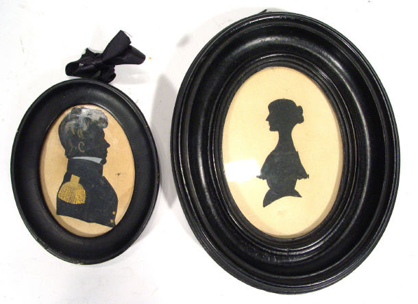 Appraisal: Two oval portrait silhouettes in ebonised frames one with script