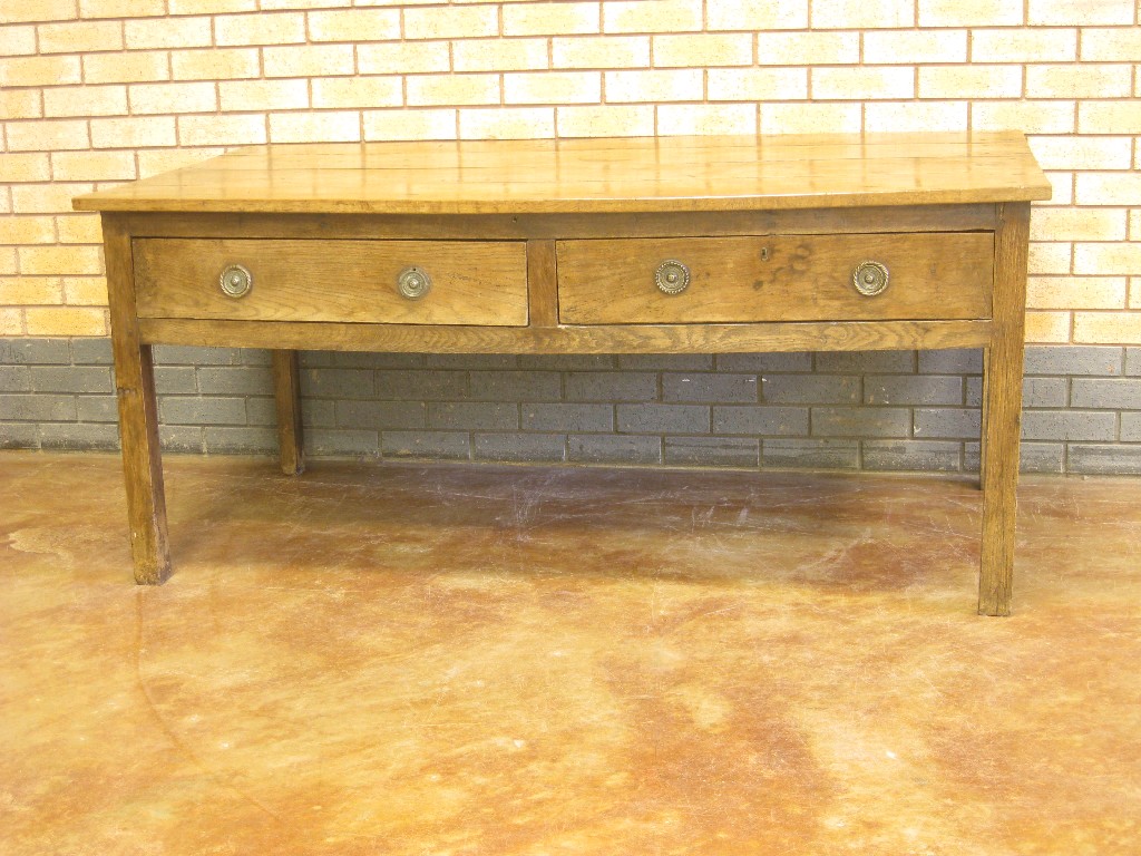 Appraisal: An antique fruitwood Centre Serving Table fitted two drawers on