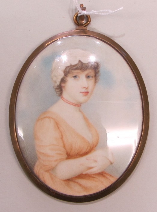 Appraisal: An oval portrait miniature of a lady wearing a pale