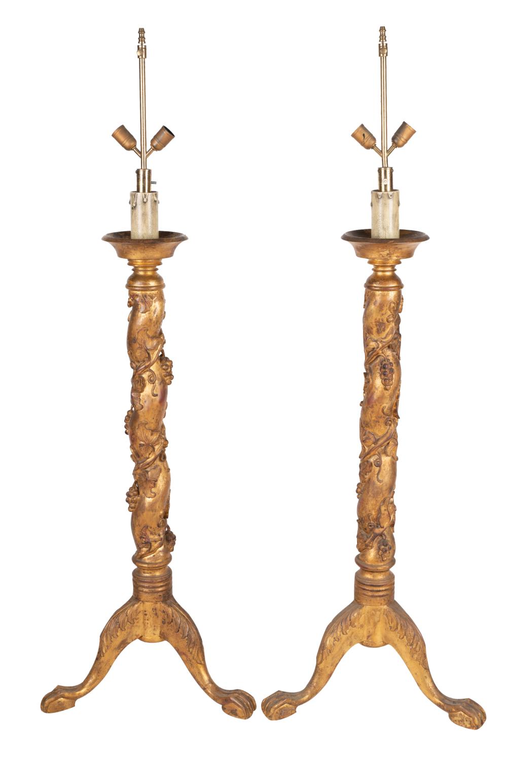 Appraisal: PAIR OF GILTWOOD TORCHIERESconverted into floor lamps on ball and