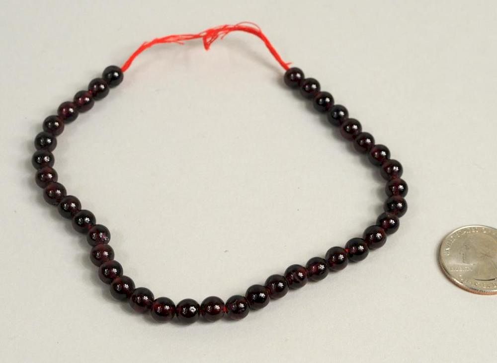 Appraisal: Strand Of Round Garnet Beads Strand of round garnet beads