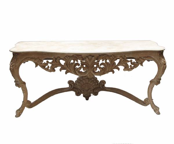 Appraisal: A Regence style limed wood and travertine top console table