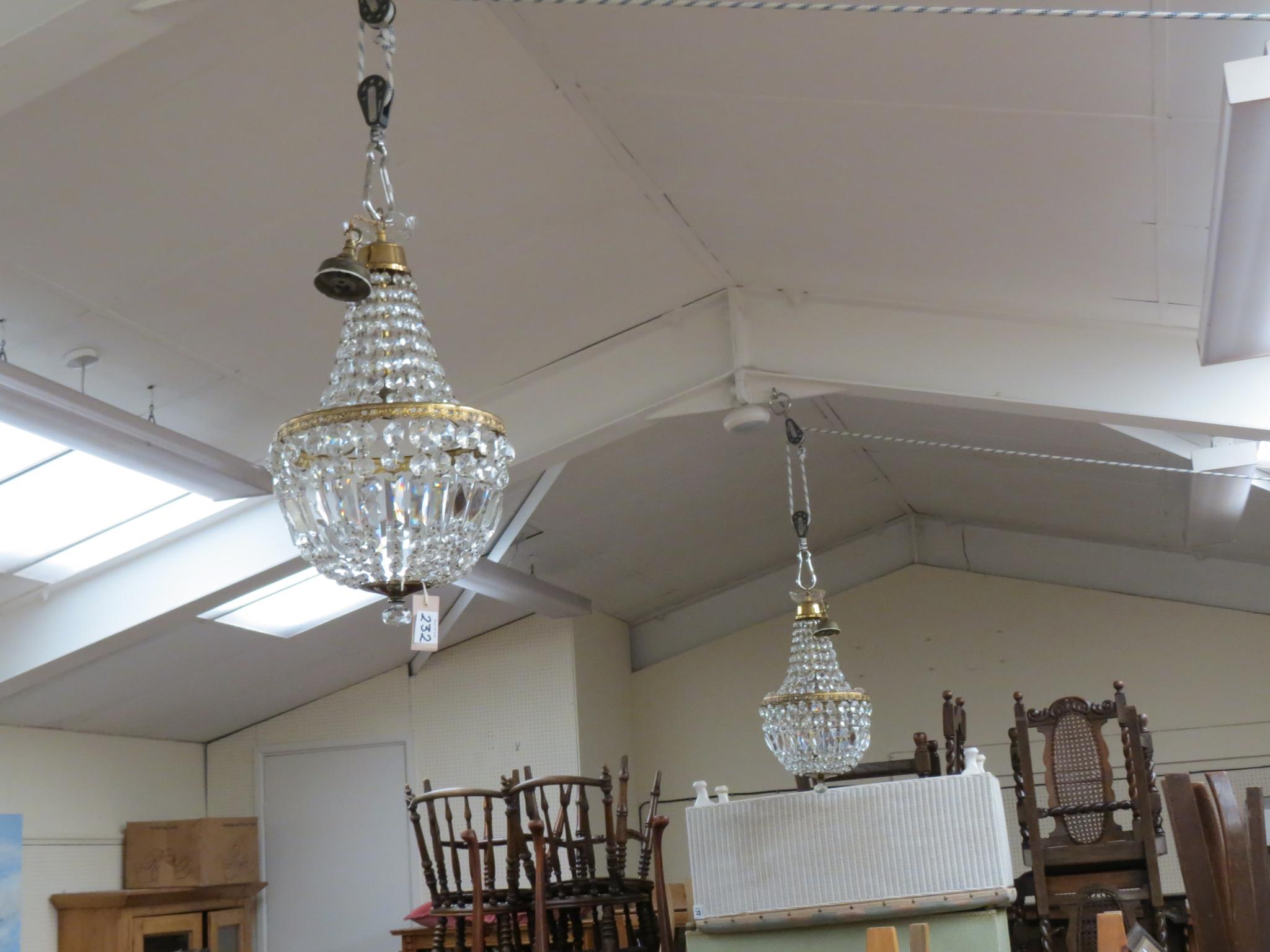 Appraisal: Three brass and glass ceiling chandeliers each with numerous cut