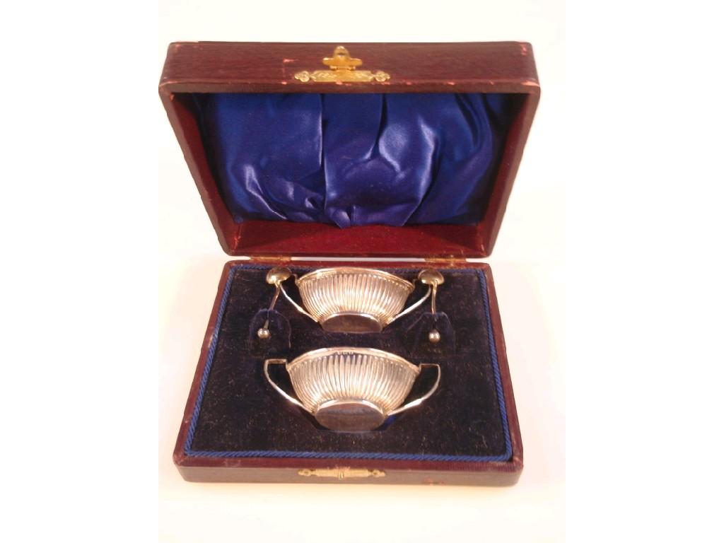 Appraisal: A pair of Edwardian oval silver salts with fluted decoration