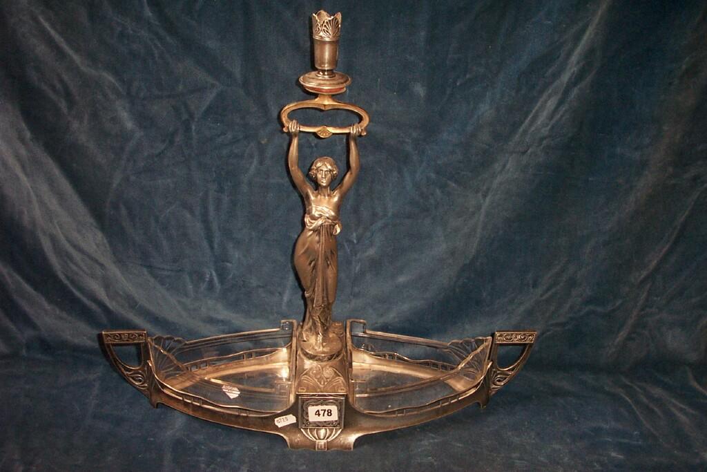 Appraisal: A WMF silver-plated -sectional table centre with central cast figure