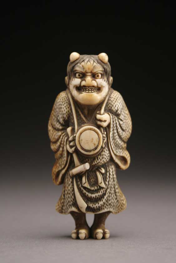 Appraisal: LARGE IVORY NETSUKE Large and finely carved ivory netsuke of