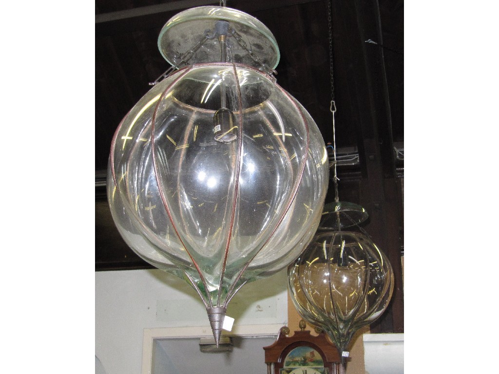 Appraisal: Pair of moulded glass and wrought iron ceiling lights