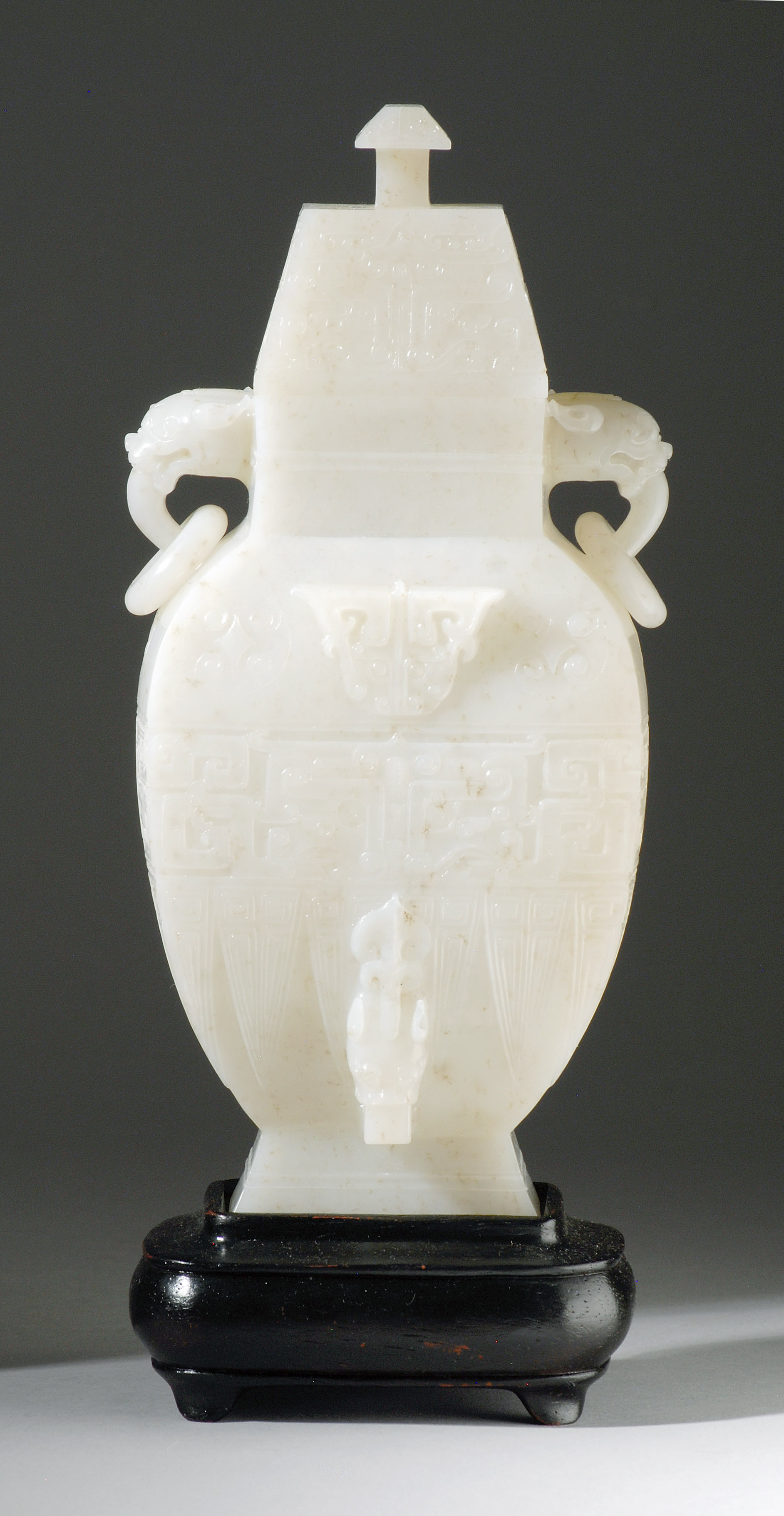 Appraisal: WHITE JADE COVERED VASE In rectangular baluster form with lion's-head