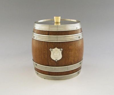 Appraisal: A Victorian silver mounted biscuit barrel the oak body with