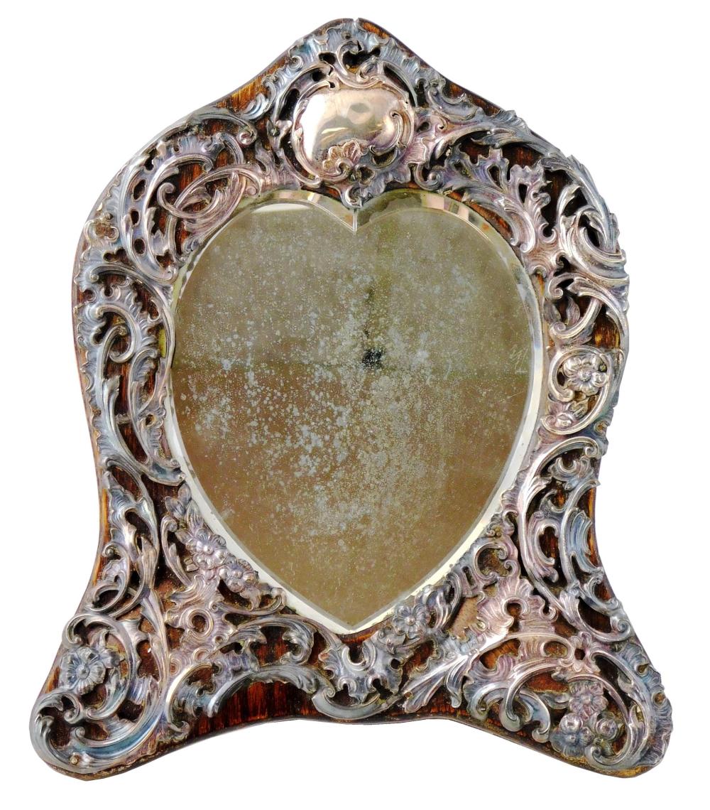 Appraisal: SILVER English silver repousse mounted mirror London reticulated sterling overlay