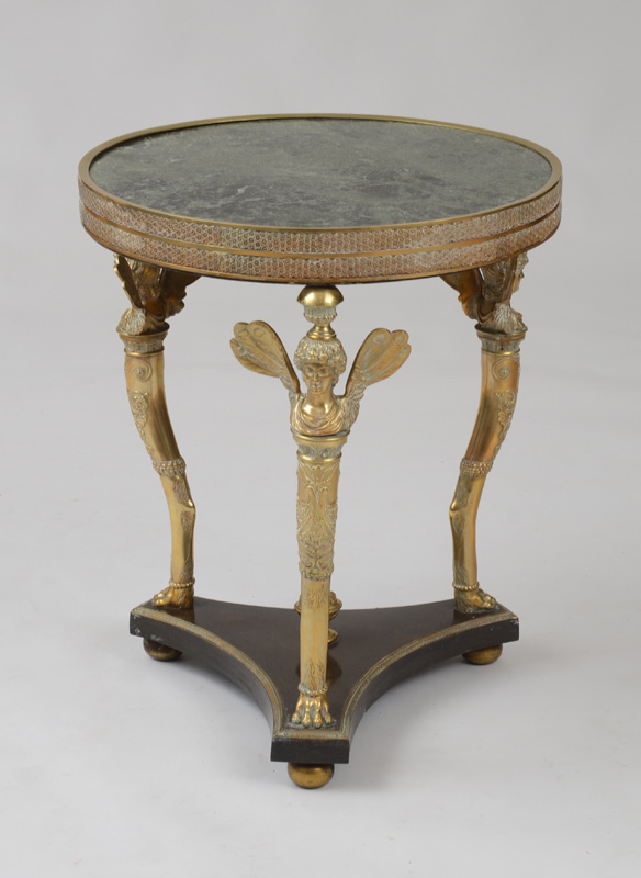 Appraisal: EMPIRE STYLE ORMOLU AND MARBLE GU RIDON With an inset