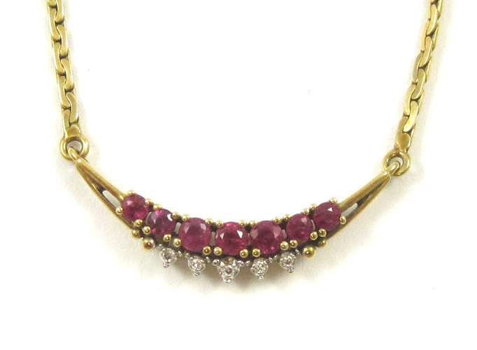 Appraisal: RUBY AND FOURTEEN KARAT GOLD NECKLACE the pendant set between