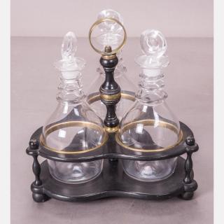 Appraisal: A Regency Style Ebonized Wood and Brass Three Bottle Decanter