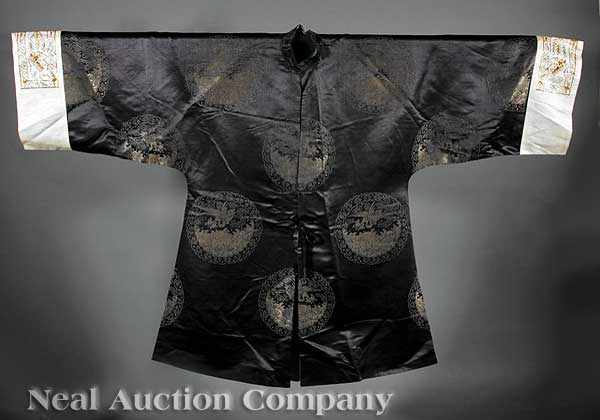 Appraisal: A Chinese Silk Surcoat late th c the midnight blue