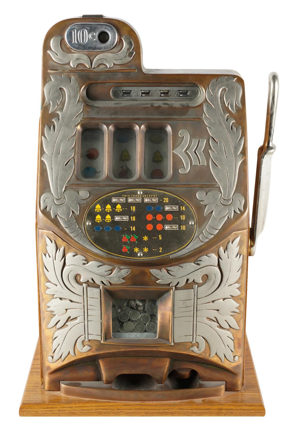 Appraisal: MILLS TEN CENT SLOT MACHINEon oak plinth of later date