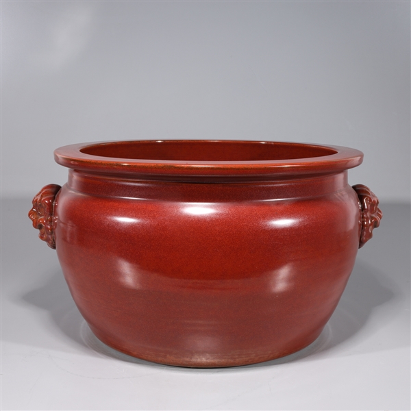 Appraisal: Chinese red glazed porcelain basin with animal mask handles overall