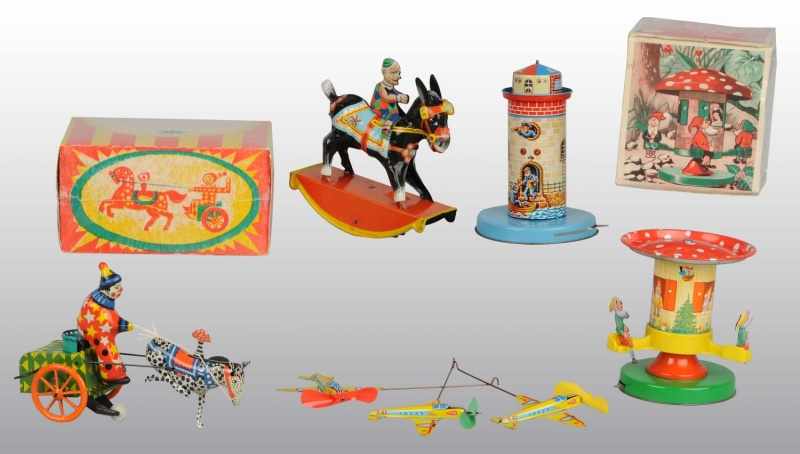 Appraisal: Lot of Tin Litho Wind-Up Toys Description Working Includes one