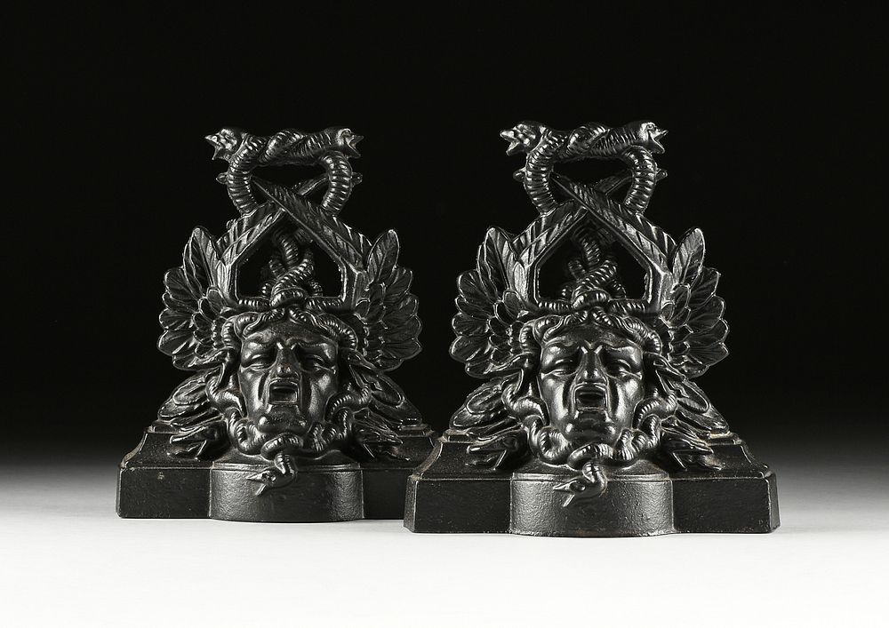 Appraisal: A PAIR OF VICTORIAN CAST IRON MEDUSA HEAD DOOR STOPS