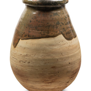 Appraisal: A Slip Glazed Pottery Storage Jar Height x diameter inches