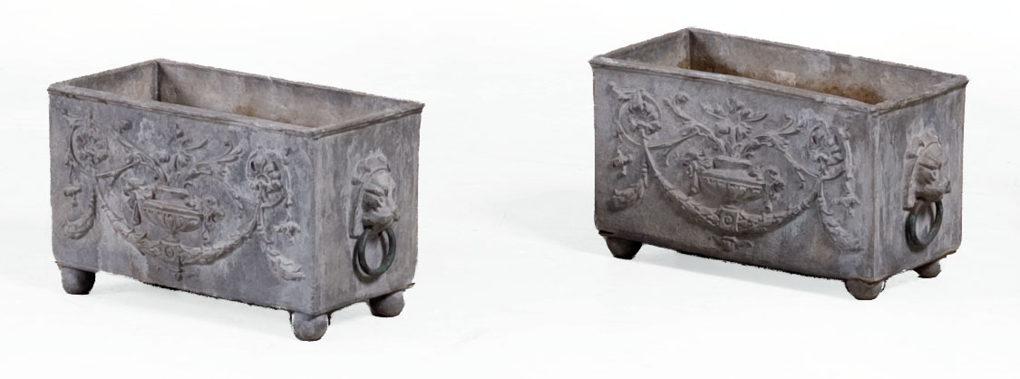 Appraisal: PAIR OF RECTANGULAR CAST-LEAD PLANTERS WITH URN AND FLORAL MOTIF