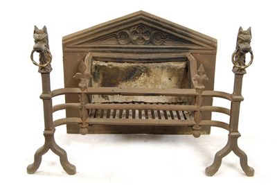 Appraisal: A cast iron fire grate in Gothic style with lion's