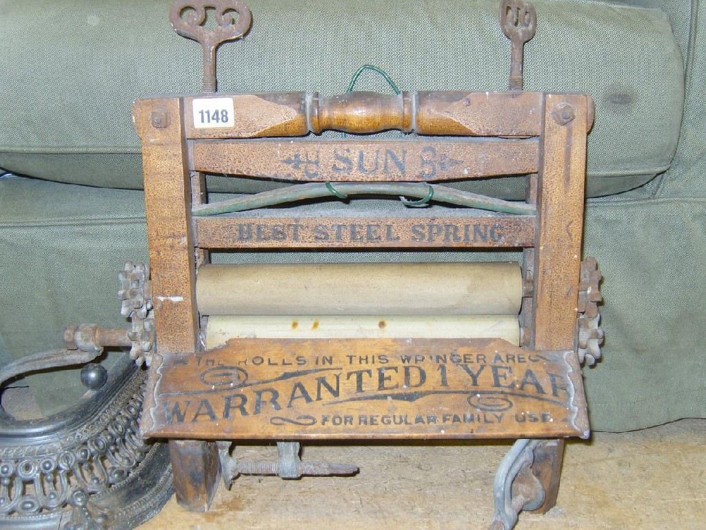 Appraisal: A miniature bench mangle with cast iron fittings by Sun