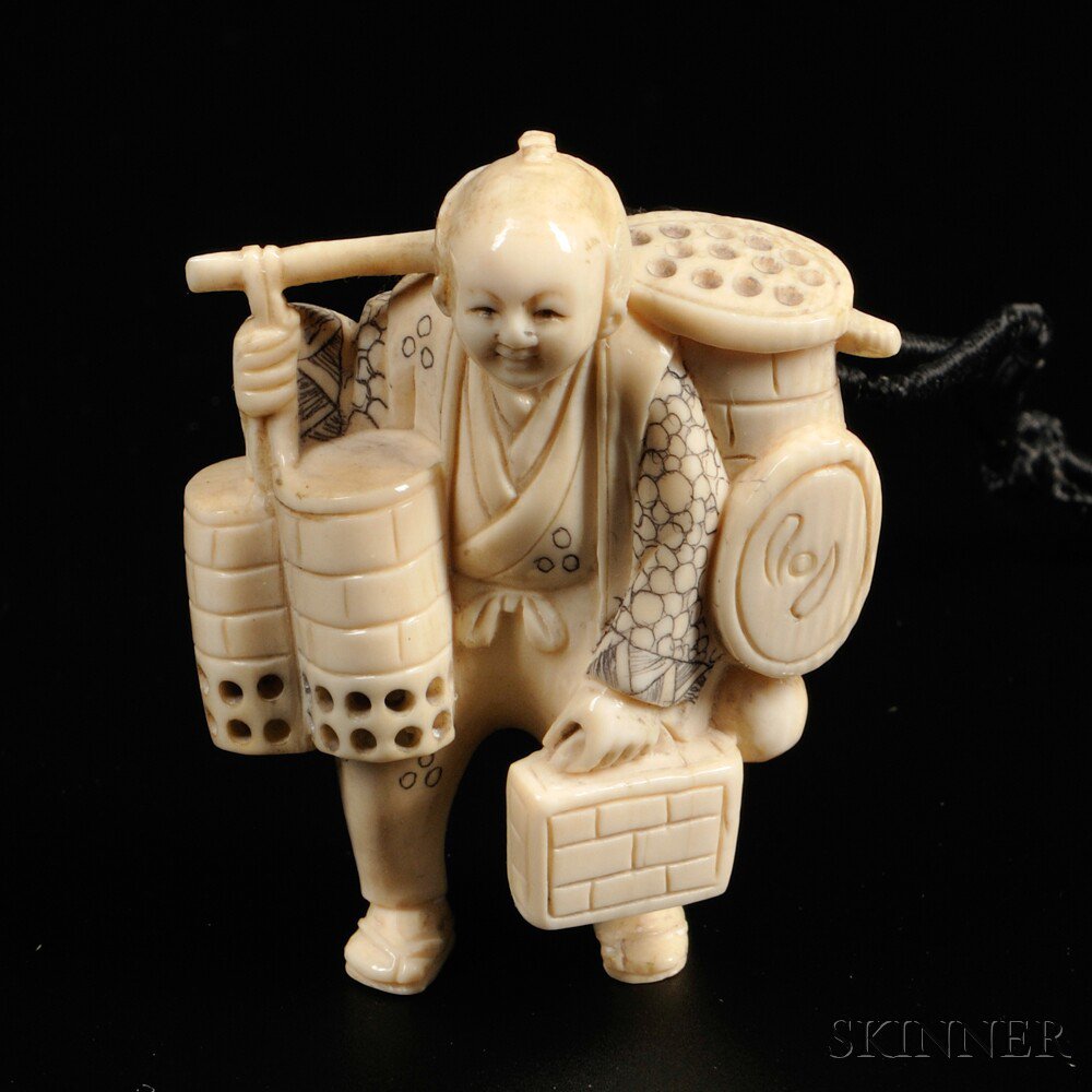 Appraisal: Ivory Netsuke Japan Meiji period carved as a man carrying