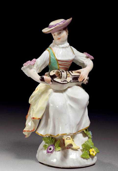 Appraisal: FIGURE OF A BARREL ORGAN PLAYER Meissen circa Model by