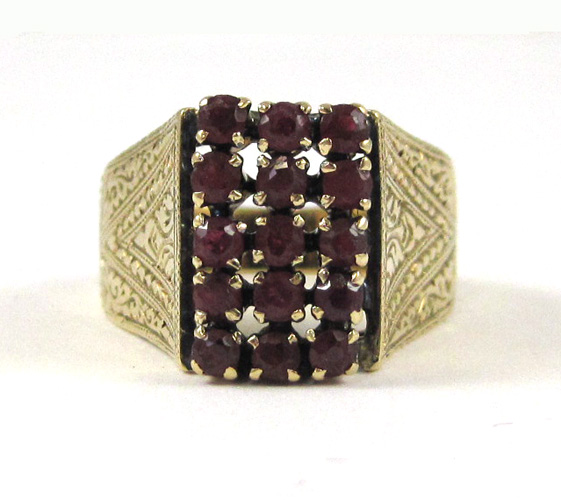 Appraisal: RUBY AND EIGHTEEN KARAT GOLD RING set with round-cut rubies