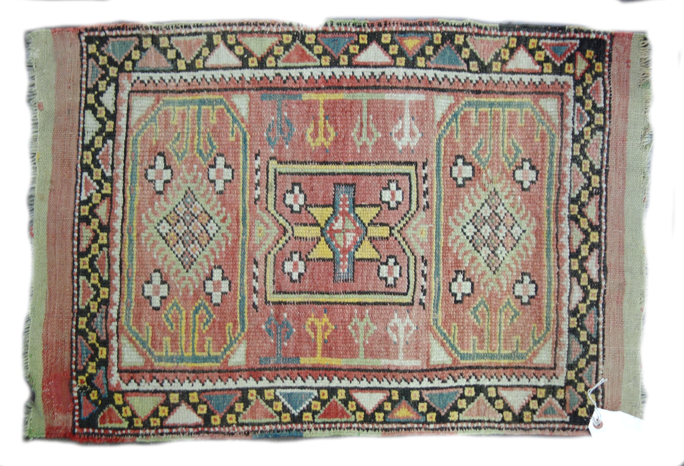 Appraisal: A Caucasian mat with faded red field cm x cm