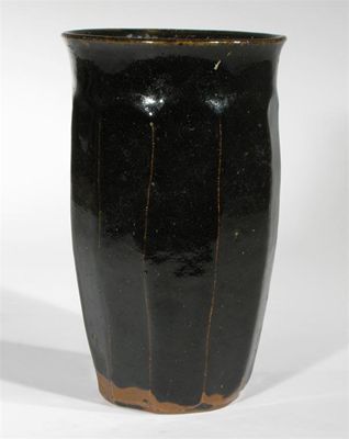 Appraisal: A cut-sided stoneware vase in the style of Bernard Leach