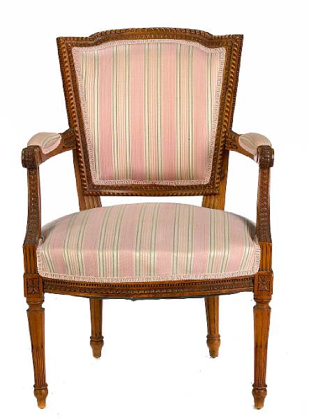 Appraisal: A Louis XV style carved fruitwood and upholstered open armchair