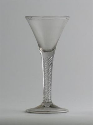 Appraisal: A large wine glass with flared bowl raised on an