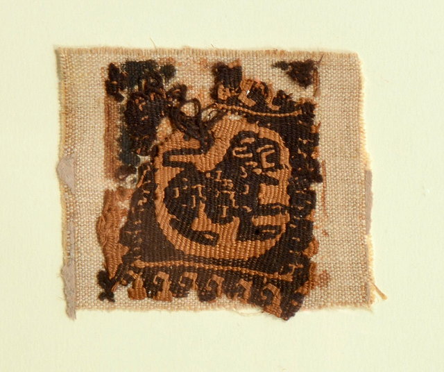 Appraisal: A SQUARE FRAGMENT with a circular central panel of a