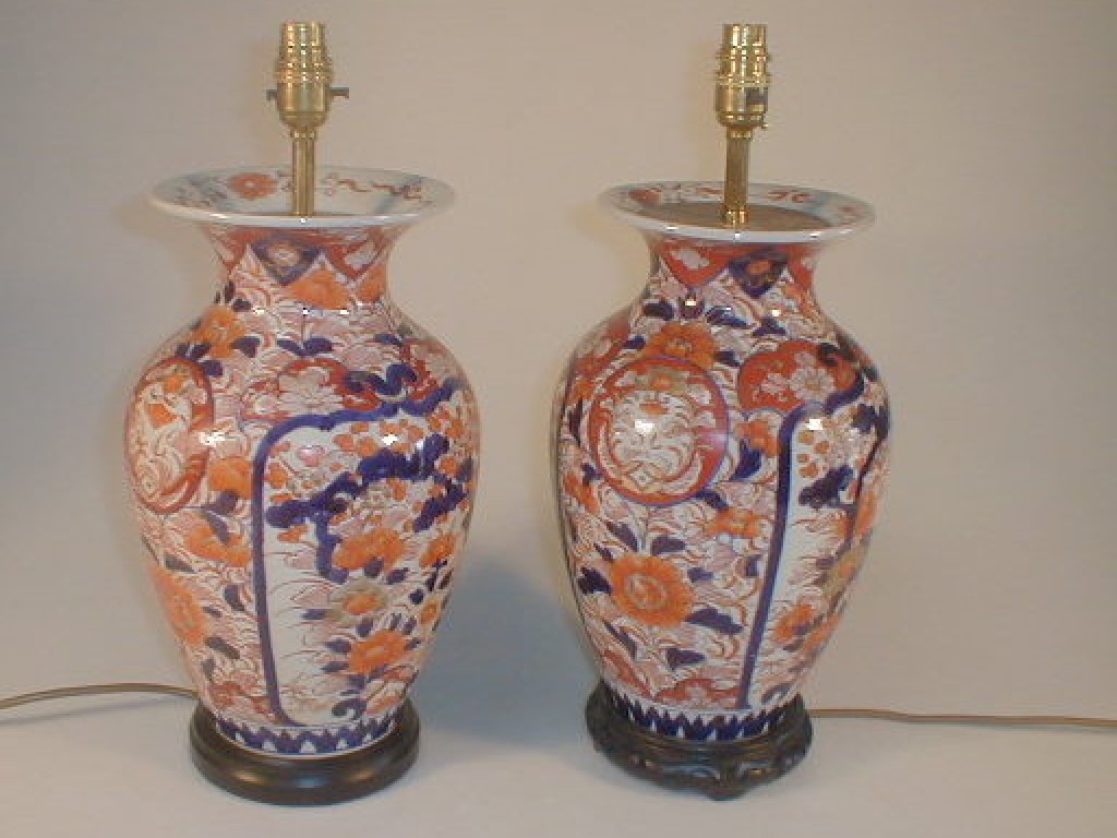 Appraisal: A pair of Japanese Imari baluster vase table lamps painted