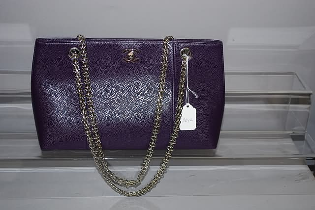 Appraisal: Purple pigskin hand bag with silver chain Neiman Marcus price