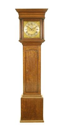 Appraisal: A figured oak longcase clock with an eight day movement