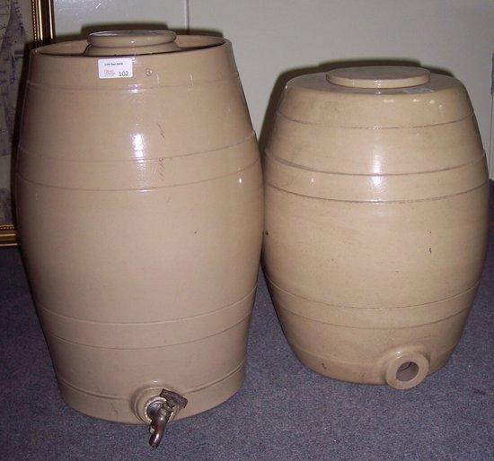 Appraisal: Two stoneware storage jars of barrel shape with circular lids