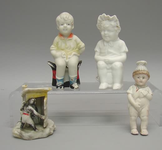 Appraisal: Lot of bisque potty related figurines Girl w molded bonnet