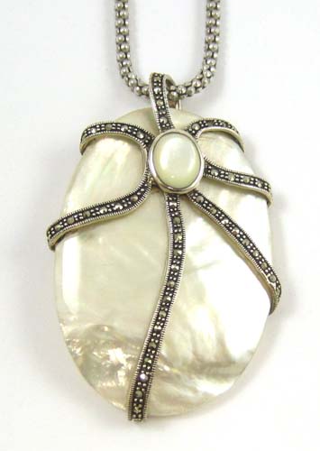 Appraisal: MOTHER-OF-PEARL OVAL PENDANT NECKLACE having an octopus-like silver frame with