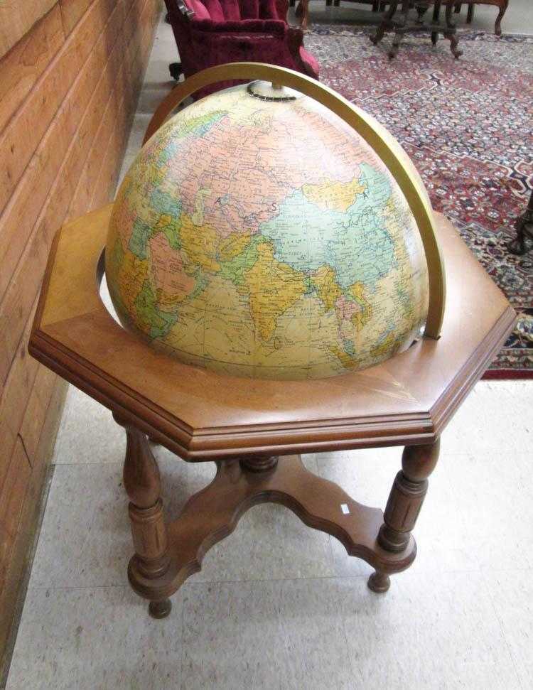 Appraisal: AN ILLUMINATED WORLD GLOBE AND FLOOR STAND featuring a D