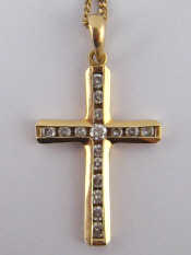 Appraisal: A carat gold diamond set cross approx x cm on