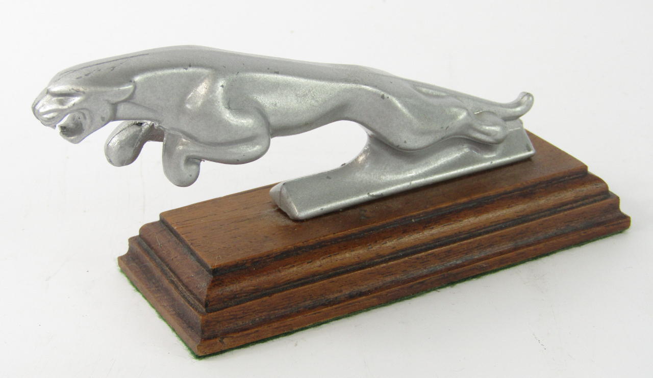 Appraisal: A Jaguar car mascot WEB on a wooden stand cm