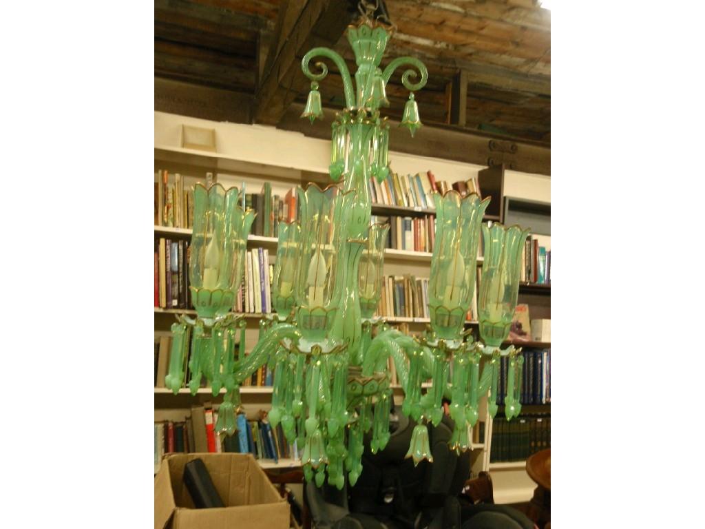 Appraisal: A European vaseline green glass chandelier with eight scrolling branches