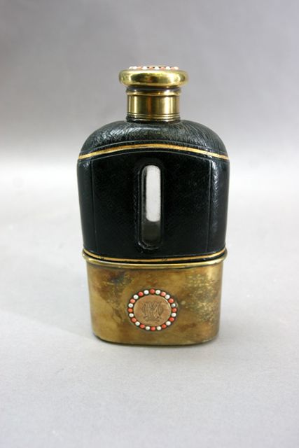 Appraisal: A leather covered Victorian hip flask with silver gilt mount