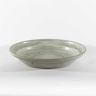 Appraisal: Paul Barron a shallow circular bowl pale blue glaze with