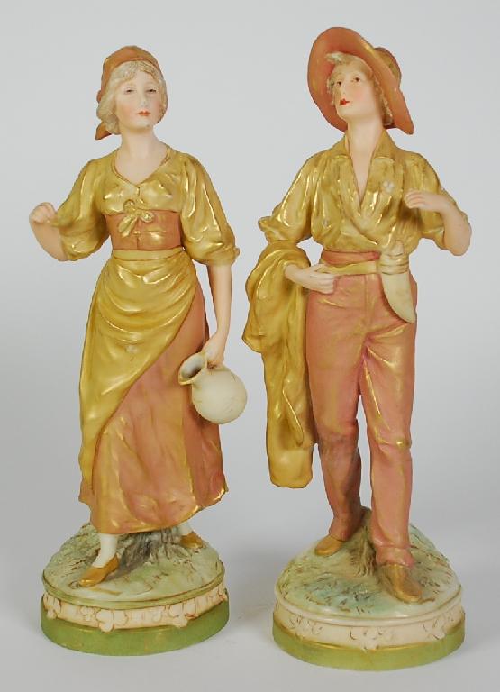 Appraisal: PAIR ROYAL DUX PORCELAIN FIGURES modelled as a maid and